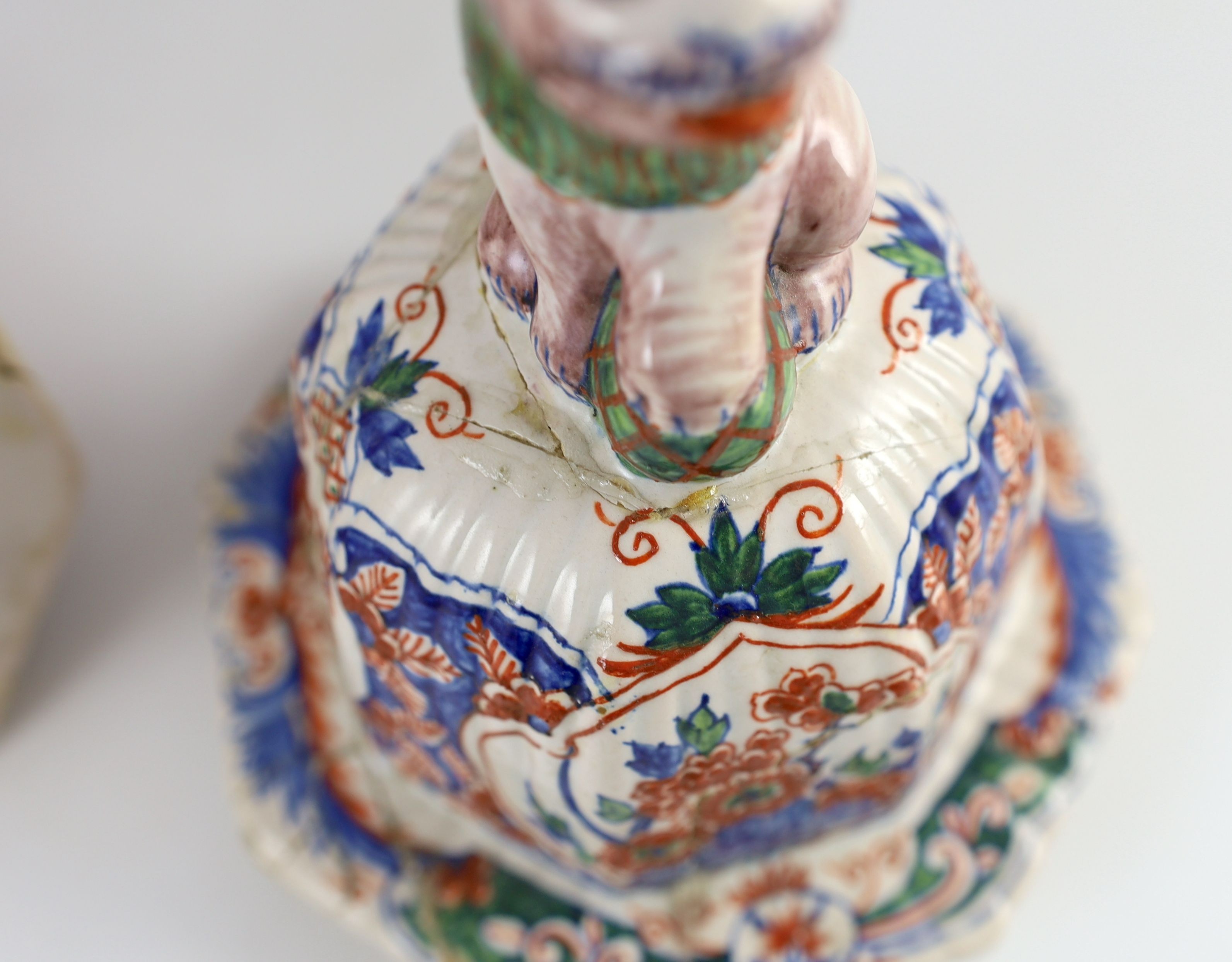 A pair of large Delft jars and covers, Pieter Kocx factory De Grieksche A, c.1701-1722, 50.5cm high, damage to covers